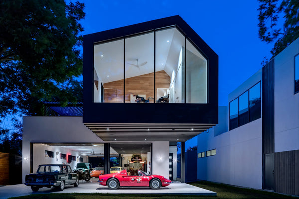 Car collector home garage, with living space situated directly above and with views into an open garage.