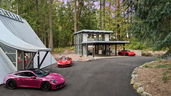 steel and glass a-frame garage workshop in washington state with porsche
