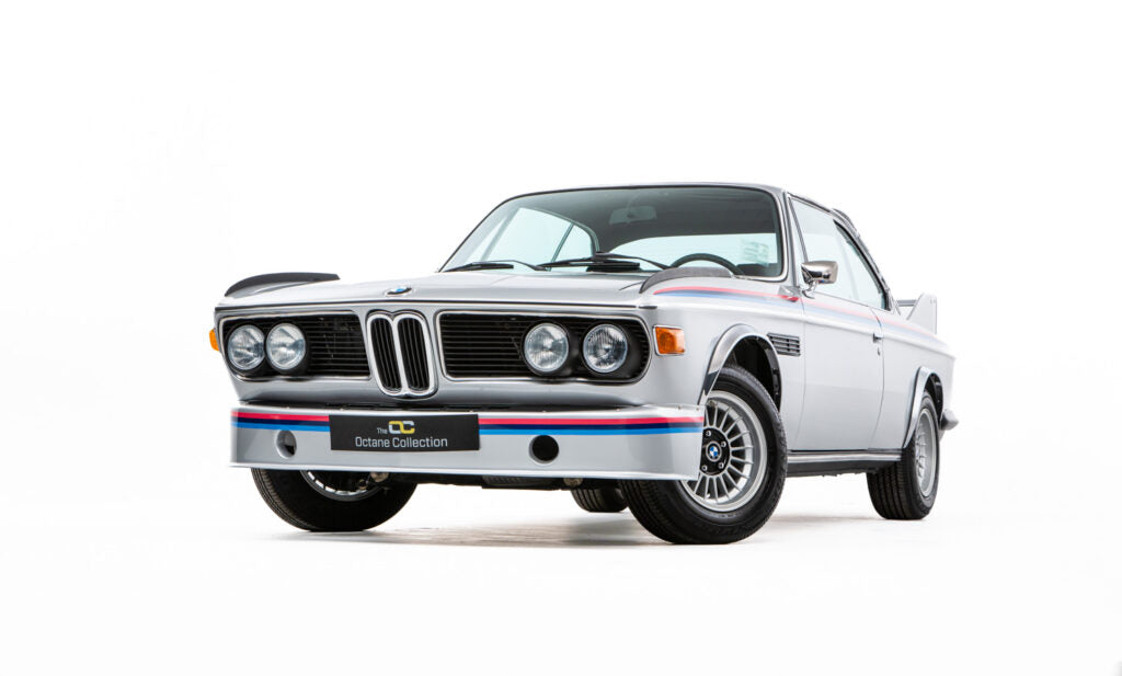 Vintage silver 1973 BMW 3.2 CSL Batmobile with a white background