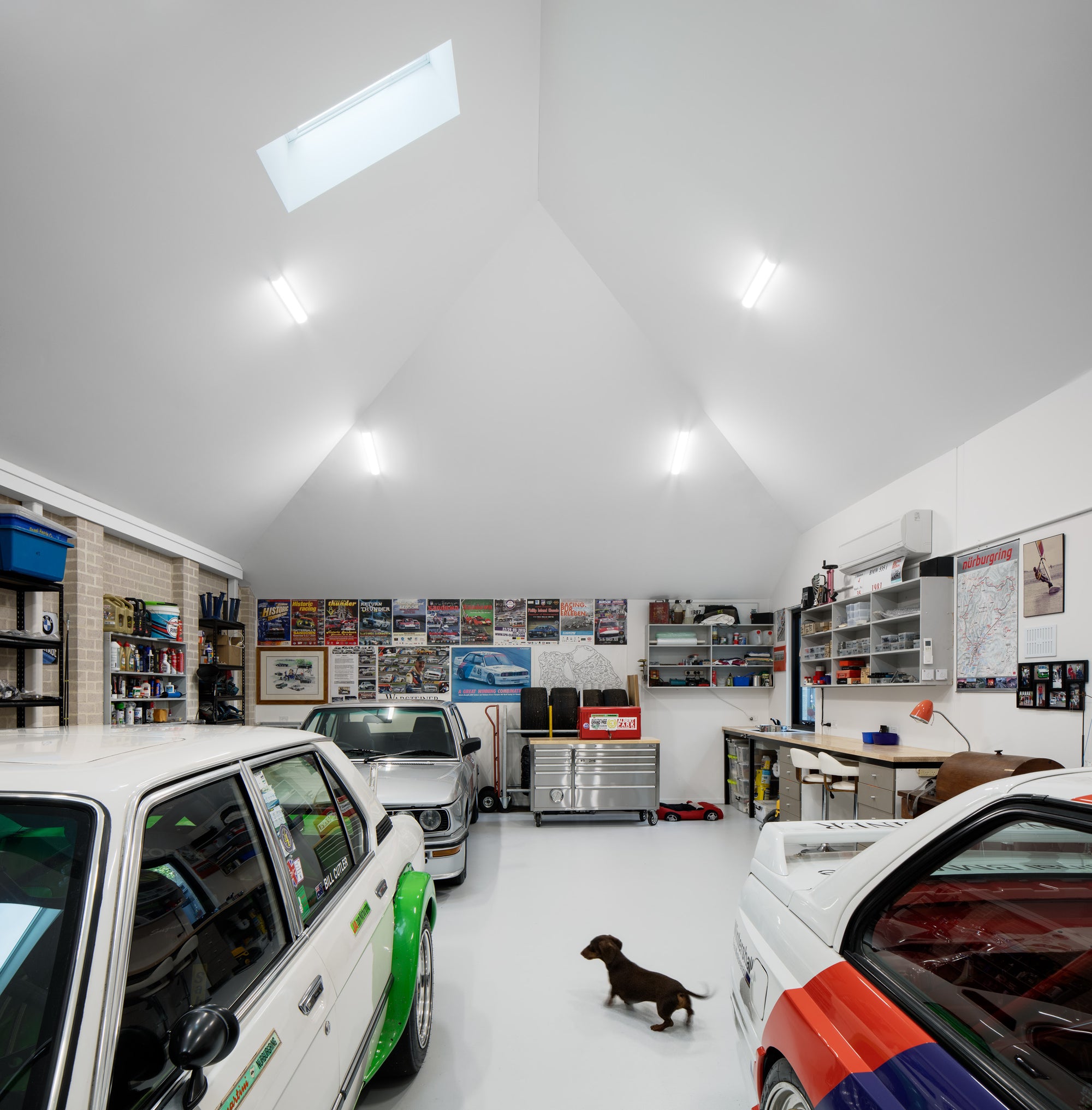 Interior of BMW vintage rally car workshop with vaulted skylight ceiling and racing memorabilia in Kew, Melbourne