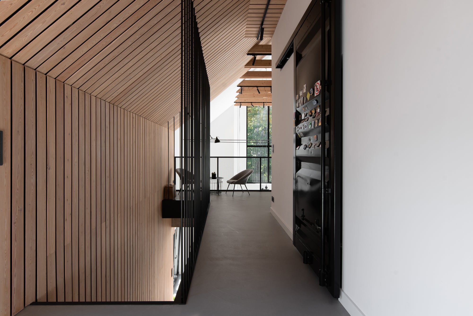 Modern interior with wooden paneling and a view of the outdoors set in Poland